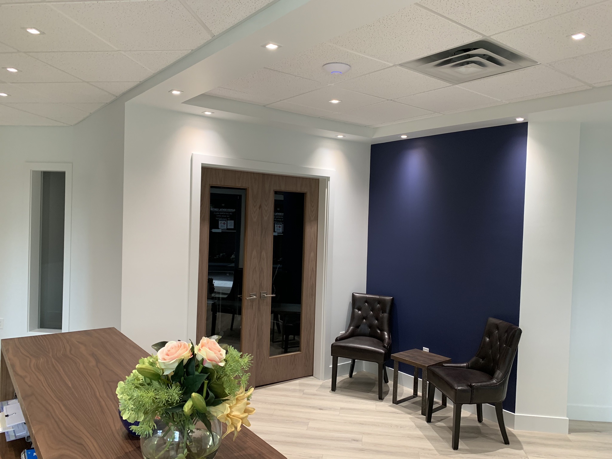 Commercial reception area with navy feature wall